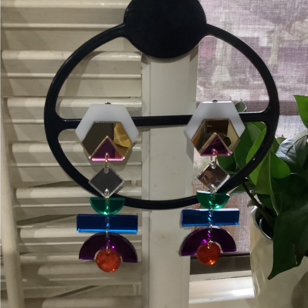 Multicolor clip on asymmetric earrings.